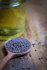 Fototapeta na wymiar Mustard Seeds and oil bottle