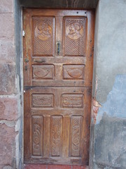 Closeup of an old wooden door in north of Spain, Camino de Santiago, Way of St. James, Journey from Najera to Granon, French way, Spain