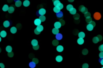  Garland lights on the Christmas tree. Blurred defocused christmas background for design.