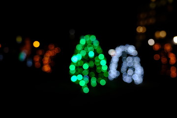  Garland lights on the Christmas tree. Blurred defocused christmas background for design.