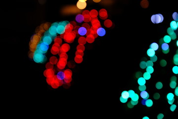  Garland lights on the Christmas tree. Blurred defocused christmas background for design.