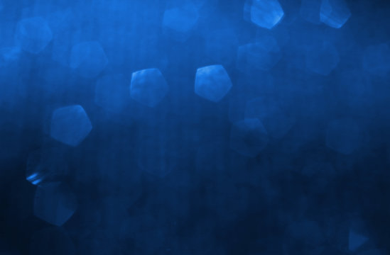 glitter classic blue lights background. de-focused. color of the year 2020