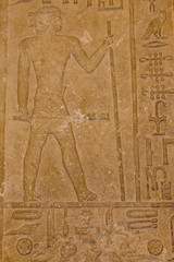 Fototapeta premium Egipskie starożytne hieroglify na kamiennej ścianie
