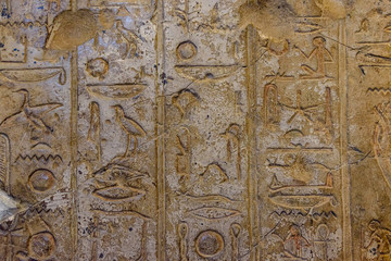 Egyptian ancient hieroglyphs on the stone wall