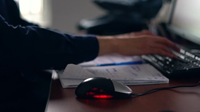 Close up of computer programmer at work in slow motion