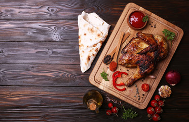 Fototapeta na wymiar Roasted chicken with spices and vegetables
