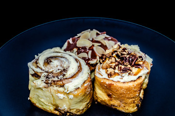 Cinnamon buns on white plate