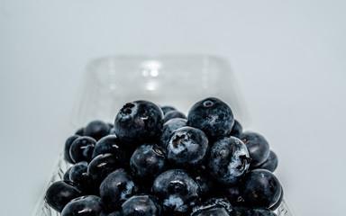 Delicious blueberries in plastic box from market