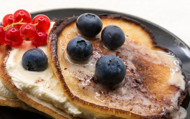 Breakfast fritters with cream and fresh berries