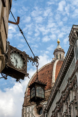 Italy, Florence: beautiful street clock on the background of the Cathedral of Santa Maria del Fiore.