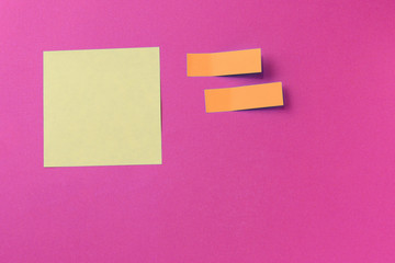 Sticker notes on a bright pink background. Top view, copy space. Business concept, horizontal mock-up