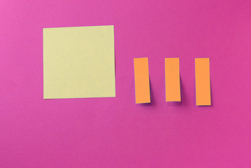 Sticker notes on a bright pink background. Top view, copy space. Business concept, horizontal...