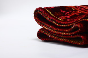 Red praying rug on a white isolated background