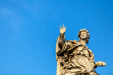 Fototapeta premium Statue of an angel on the Bridge of the Holy Angel (Eliev) in Rome, Italy.
