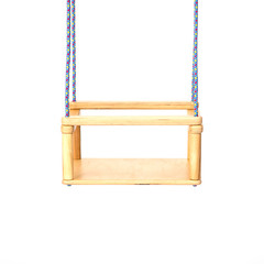 Children's swing fixed on the ropes on the white .