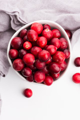 Ceramic bowl of Cranberry on white background