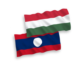 National vector fabric wave flags of Laos and Hungary isolated on white background. 1 to 2 proportion.