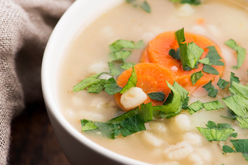 Barley soup, pearl barley in white bowl