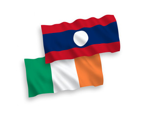 National vector fabric wave flags of Ireland and Laos isolated on white background. 1 to 2 proportion.