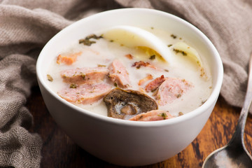 Traditional easter white borscht with eggs and sausage