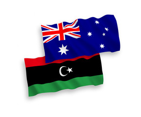 National vector fabric wave flags of Australia and Libya isolated on white background. 1 to 2 proportion.