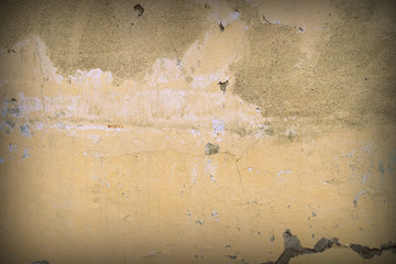 Wall of an old abandoned house close-up. Abstract background retro style toned. Black vignetting