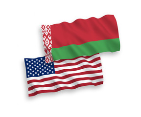 Obraz premium National vector fabric wave flags of Belarus and USA isolated on white background. 1 to 2 proportion.