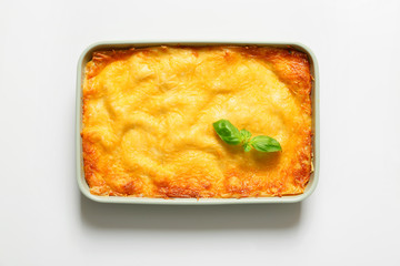 Tasty baked lasagna on white background
