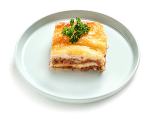 Plate with tasty baked lasagna on white background