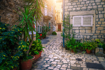 Town of Hvar and old stone houses with paved alley