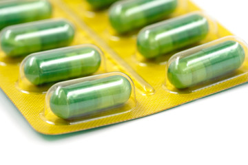 Pills in pack isolated on white background. close-up