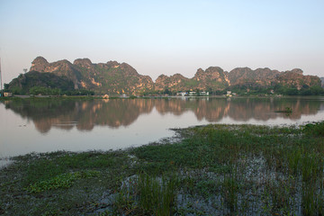 Panoramic view of karst formations  in Tam Coc, a part of Trang An Complex , was declared a UNESCO World Heritage Natural and Cultural Monument.Ninh Binh province, Vietnam