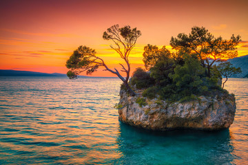 Rock island and Adriatic sea at sunset, Brela, Dalmatia, Croatia