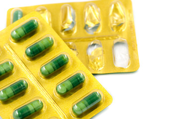 Pills in pack isolated on white background. close-up