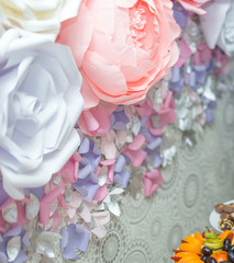 Floral background texture for a wedding scene. Roses, peonies and hydrangeas, artificial flowers on the wall. Banner fow site.