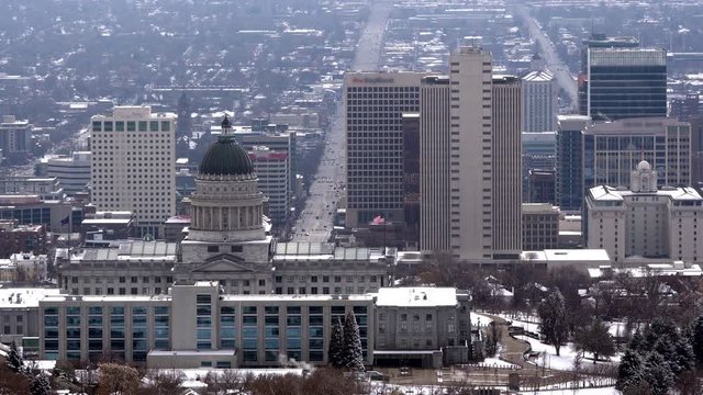 View of downtown Salt Lake City on gloomy day viewing the Capitol from Ensign Peak.