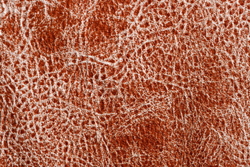 Brown natural leather texture with a pattern. Real animal skin background texture.
