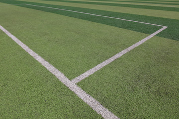 Obraz premium White markings on the green runway