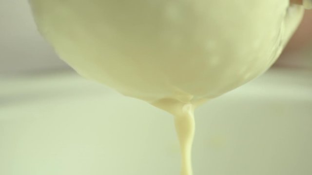 Preparation for making Tofu, squeezing soy milk out of blended soy bean.
