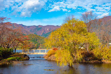 Kawaguchiko Lake. Japan. Yazaki Park. National Park near Lake Kawaguchiko. Bridge over the strait. Scenery of the city of Fujikawaguchiko. Excursion to five lakes of fuji. Nature. Travel to Japan