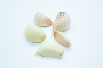 Garlic cloves located on a white background
