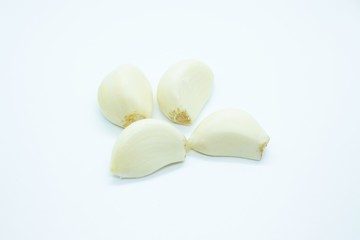 Garlic cloves located on a white background