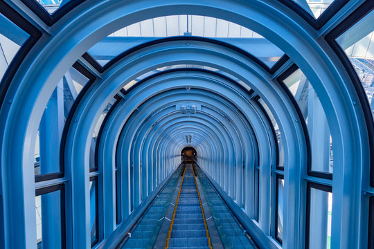 Osaka. Japan. Escalator between the buildings. Escalator between two skyscrapers. Modern architecture of Japan. Hanging in the air escalator inside view. Osaka city tour. Japan business.