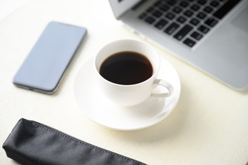 Obraz na płótnie Canvas caffee and caffee cup and laptop pc and smartphone