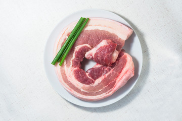 A selection of pork belly on white background