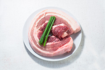 A selection of pork belly on white background