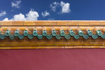 The Forbidden City wall under the blue sky and white clouds
