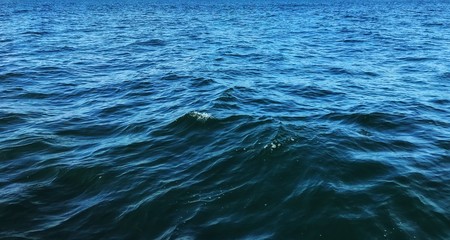Deep blue ocean with waves for water sea background and wallpaper. 