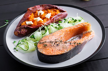 Healthy food: baked salmon and sweet potato and vegetables. Diet menu.
