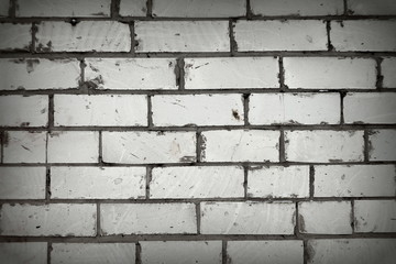 White brick wall. Background with a rough brickwork texture. Horizontal orientation. Stock photo. Place for your text. Loft style